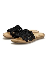Sandali slide neri in macramè con tomaia intrecciata, caratterizzati da una suola piatta beige e una soletta morbida e testurizzata. Motivo geometrico decorativo.