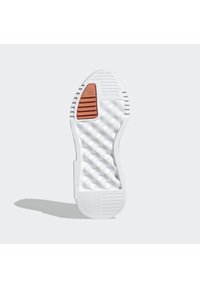 White sneaker sole featuring textured rubber with a ribbed design. Includes a brown striped accent. Smooth overall with a rounded shape.