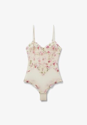 Body beige en dentelle florale avec bretelles fines réglables, délicate broderie rose et verte, et fermetures par boutons-pression à l'entrejambe.