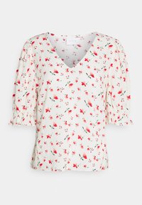 Blusa floreale con scollatura a V, maniche corte a palloncino e sfondo crema. Presenta fiori rossi e rosa con foglie verdi. Tessuto leggero.