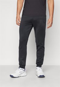 Sergio Tacchini MORET PANTS - Treniņtērpa apakšdaļas - black