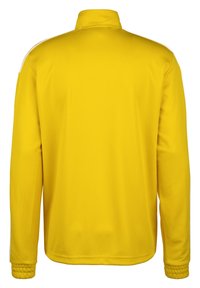 Veste jaune avec un col montant, des manches longues et des poignets élastiques. Texture de tissu lisse, avec des accents blancs le long des épaules.