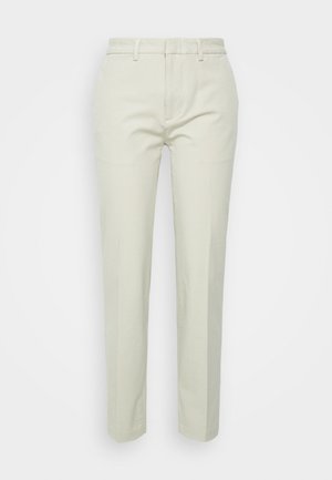 Gai beigā krāsa taisnu kāju bikses, kas izgatavotas no kokvilnas, ar plakanu priekšpusi, jostas cilpām un bez redzamām kabatām vai rakstiem.