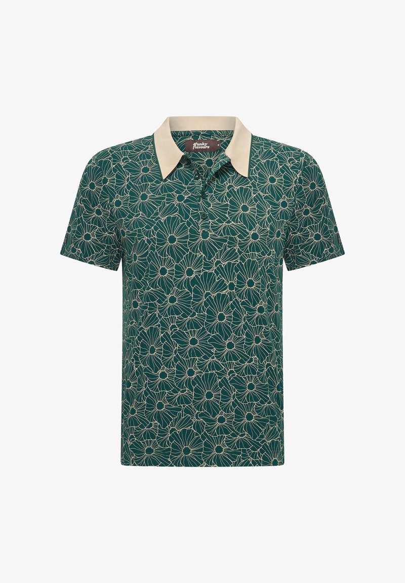 T-paita lyhythihaisena tummanvihreänä, jossa on vaaleanbeige ja valkoinen kukkakuosi. Ominaisuuksiin kuuluu kontrastivärinen vaaleanbeige kaulus ja pehmeä textura.