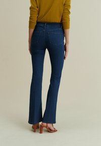 Next STRETCH  STANDARD - Flared Jeans - inky blue
