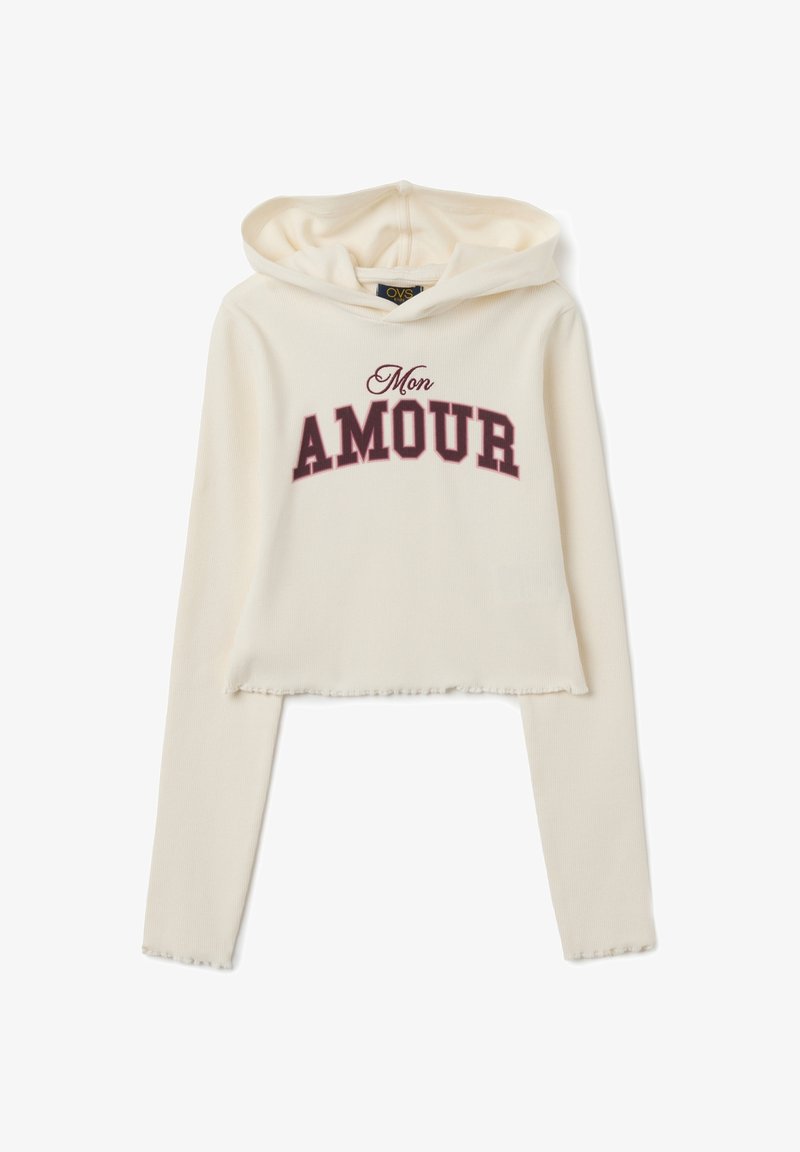 Crème geknipte hoodie gemaakt van ribbelstof, met een bordeauxrode "Mon AMOUR" graphic. Inclusief een capuchon met trekkoord en een raw edge zoom.