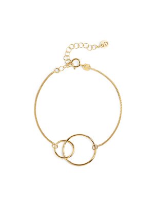 Pulsera delicada de oro con dos anillos circulares entrelazados y cierre de cadena ajustable sobre un fondo blanco.