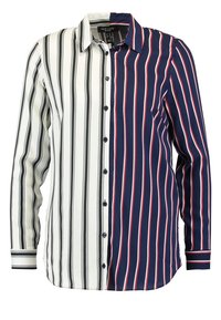 Koszula zapinana na guziki z podzielonym wzorem: lewa strona posiada czarno-białe paski, a prawa strona charakteryzuje się granatowymi paskami z czerwonymi. Długie rękawy.