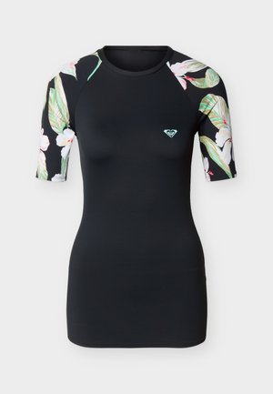 Zwart nauwsluitend rashguard met korte mouwen, voorzien van bloemenpatroon op de mouwen en een klein turquoise logo op de linkerborst.