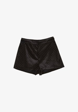 Shorts in velluto nero con vita alta e piccoli pois dorati distribuiti uniformemente su tutto il tessuto.