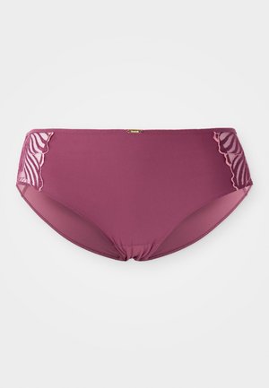 Violetti saumaton naisten alusvaate, jossa on vaaleanpunaista brodeerattua verkkokangasta sivuilla ja pieni kultainen brändilogo vyötärön keskellä.