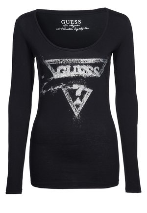 Chemise noire ajustée à manches longues avec un logo Guess blanc usé et le numéro 7 à l'intérieur d'un triangle sur le devant.