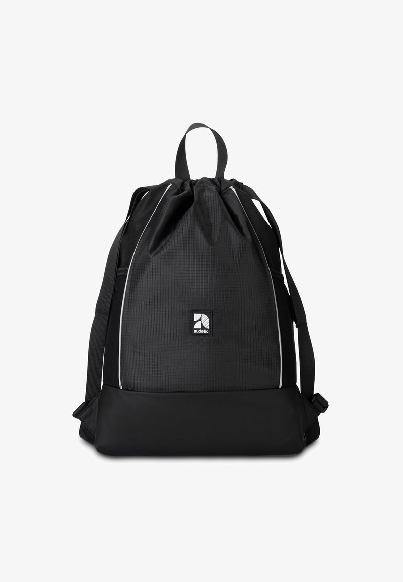 Zaino con cordoncino nero in tessuto testurizzato, accenti bianchi, grande scomparto principale e spallacci regolabili. Presenta un patch con logo sul fronte.