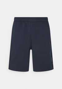 Marineblaue Sportshorts aus weichem Stoff, mit einem elastischen Bund und seitlichen Netzpaneelen für Atmungsaktivität. Einfaches Design, ohne Muster.