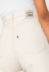 Levi's® HIGH LOOSE - Calças de ganga de perna direita - natural amber