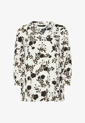 Witte blouse met een zwart bloemenpatroon, korte mouwen en een V-hals. Lichtgewicht stof met een elegante val.