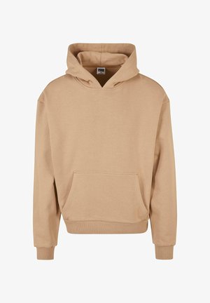 Bežinė džemperis pagamintas iš minkštos medžiagos, su dideliu priekiu kišenėje, su raišteliu reguliuojamu gobtuvu ir surišamais rankogaliais bei apykakle.