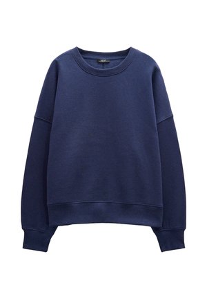 Granatowa bluza z miękkiego, teksturowanego materiału. Posiada okrągły dekolt, długie rękawy oraz ribbaną talię i mankiety dla luźniejszego kroju.