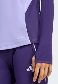 Athletic long-sleeve top in light purple and dark purple, featuring breathable Aeroready fabric, fitted design, and white accents.