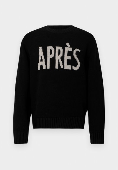 Crni pleteni pulover s riječi "APRÈS" u kontrastnoj krem boji. Klasični okrugli izrez sa rebrastim manžetama i rubom. Mekana tekstura.