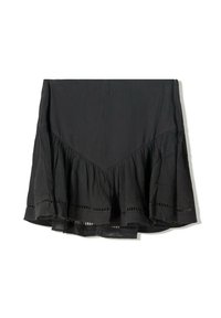 Fustă neagră cu un tiv în volane stratificat, realizată dintr-un material texturat. Prezintă detalii decupate de-a lungul marginii de jos și un design în formă de V în partea de sus.