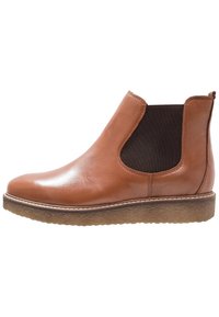 Brown leather ankle boots with a smooth finish, elastic side panels, and a rubber sole. Features a light stitching detail along the sole edge.