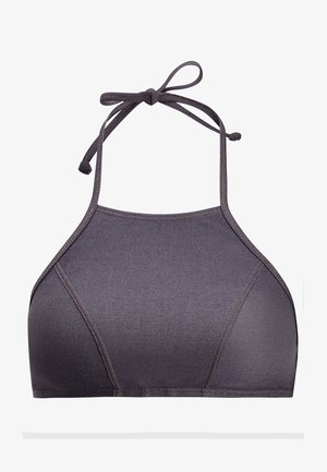 Sportbrasi, millel on kaelusega disain, valmistatud siledast, elastsetest kangast tumedas hallis, millel on peened õmblused ja reguleeritavad sidemed.