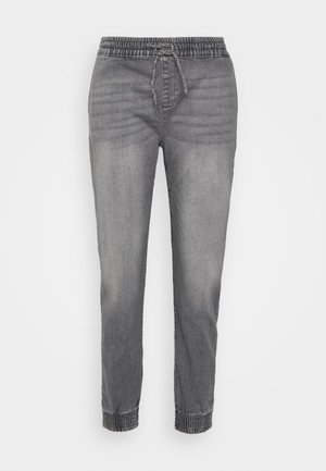 Grå denim joggerbukser med elastisk talje og snøre, med tætsiddende manchetter og en falmet struktur.