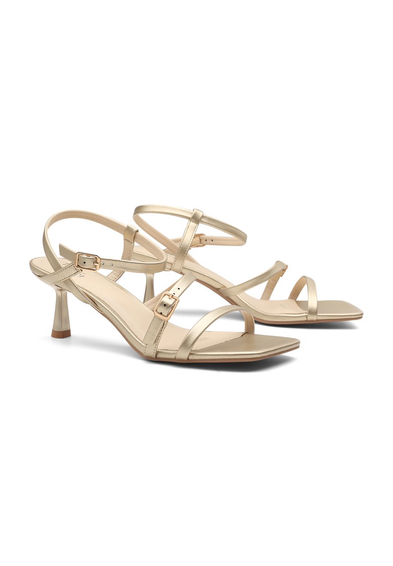 Gold metallic high-heeled sandals with multiple adjustable straps, square toe, and slender heel. Smooth texture with minimal accents.