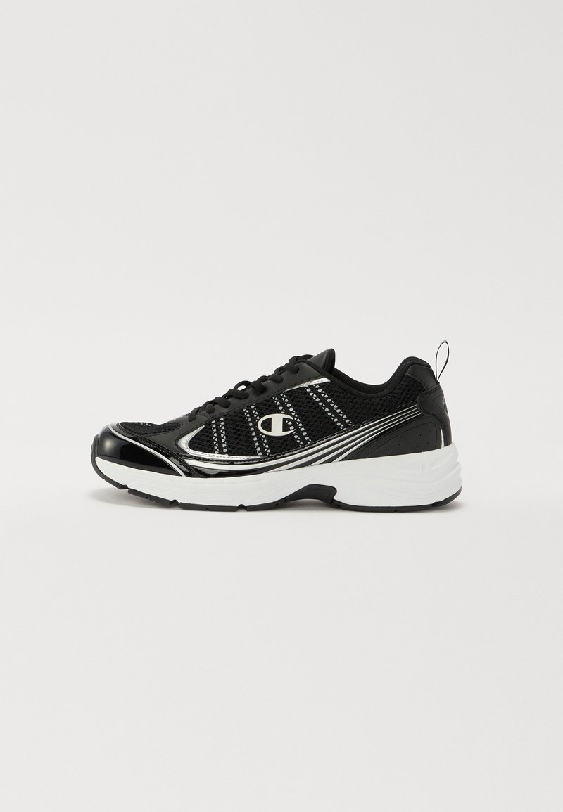 Black athletic shoe with mesh panels, shiny black accents, silver detailing, and a cushioned white midsole. Features laces and a pull tab.