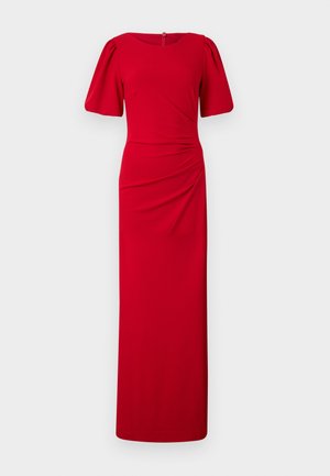 Punainen, lattiaan ulottuva mekko, jossa on tiukka siluetti, pyöreä kaula-aukko, lyhyet puffihihat ja rypytys yksityiskohtia sivuilla. Sujuva kangastuntuma.