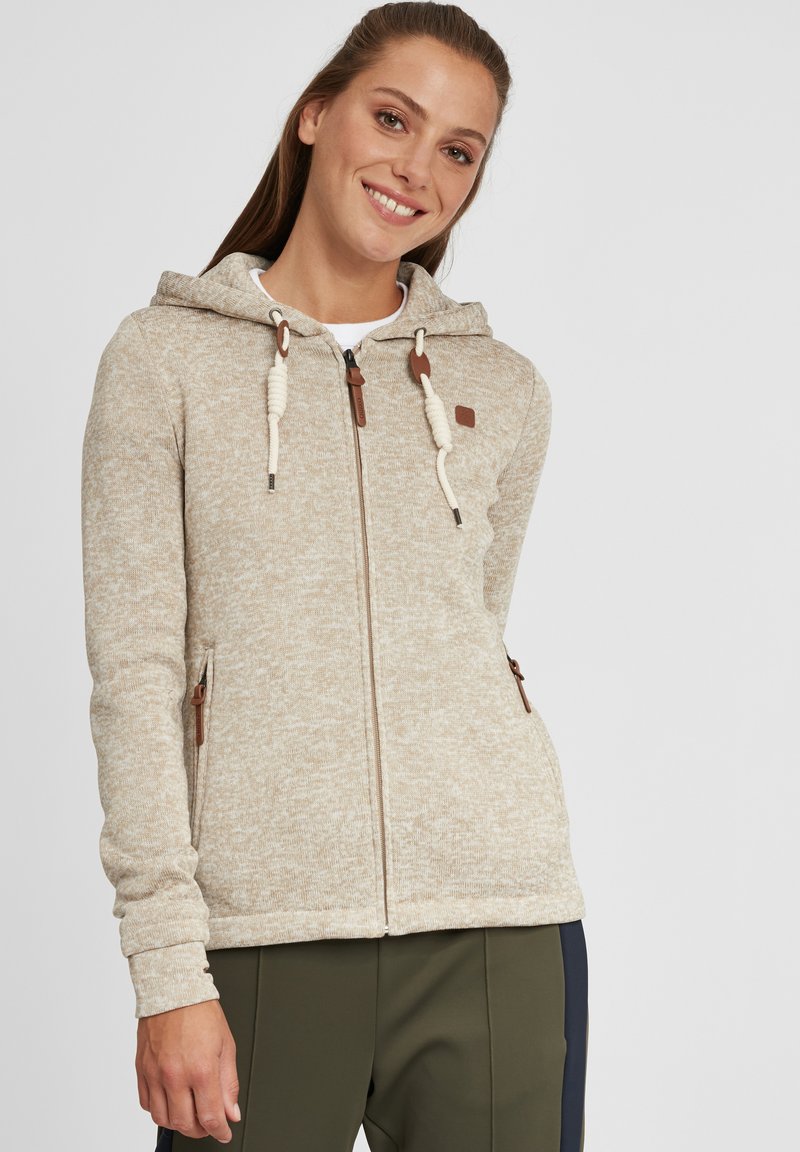 Light beige hooded sweatshirt made of textured fabric, featuring brown accents, a front zipper, and adjustable drawstrings on the hood.