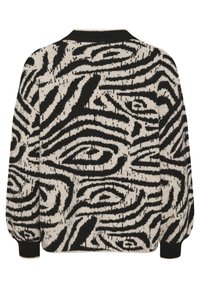 Gebreide trui met een zwart en crèmekleurig zebra-patroon, ronde halslijn, lange pofmouwen en ribgebreide manchetten. De structuur van de stof zorgt voor warmte.