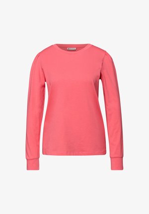Long-sleeve coral t-shirt made from soft cotton. Features a crew neckline, ribbed cuffs, and subtle gathered detail at shoulders.