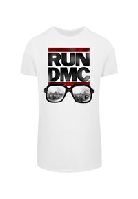White cotton t-shirt featuring a printed design with the text "RUN DMC" in black, red accents, and sunglasses overlaying a cityscape.