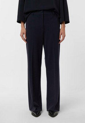 - Spodnie materiałowe