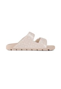 Light pink slide sandal with two wide straps, made of glossy material featuring a subtle logo pattern, and a textured, cushioned sole.