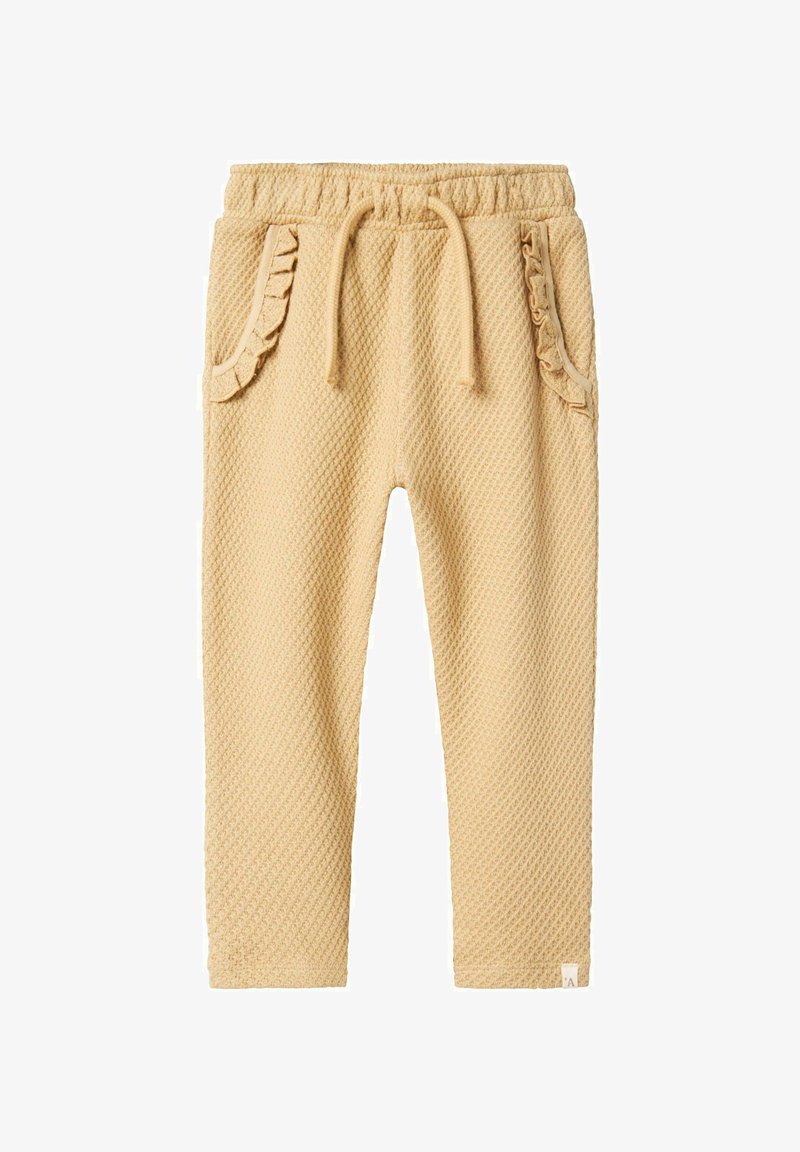 Jogginghosen aus Baumwollmischung in einem hellen Gelbton mit Waffelstruktur, gerafften Taschenakzenten, elastischem Bund und Kordelzugverschluss.