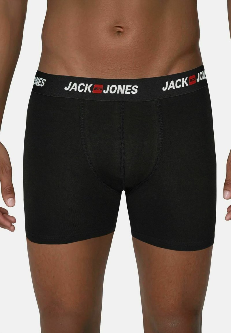 Zwarte boxershorts van katoen met een strakke pasvorm. Voorzien van een merk-elastische tailleband in het zwart met witte tekst en rode accenten.