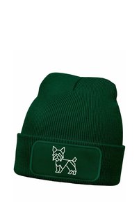 Green knitted beanie hat with a folded cuff. Features a white geometric dog design on a rectangular patch at the front.