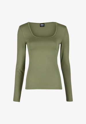 Oliivroheline pikkade varrukatega pluus ruudukujulise kaelusega, valminud siledast ja elastsetest materjalidest. Omab nahale ligitõmbavat disaini ja lihtsat allääre viimistlust.