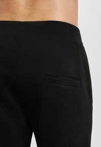 ecko unltd. Tepláky - black