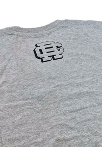 Gray cotton t-shirt with a round neckline, featuring a black logo graphic on the back. The fabric is soft with a slight texture.