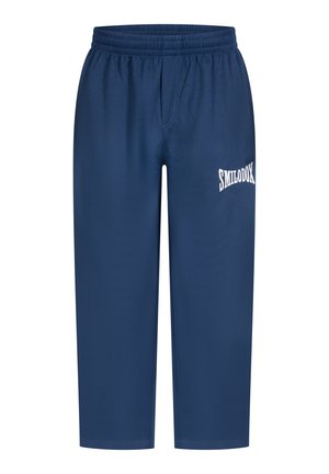 Pantalons de sport de couleur marine avec une taille élastique et une coupe ample. Présente un logo imprimé blanc sur le côté gauche. Tissu lisse et léger.