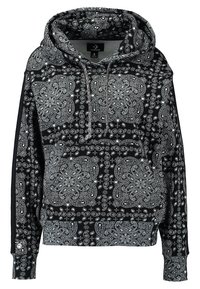 Sudadera negra con intrincado patrón de paisley blanco, capucha con cordón, bolsillo canguro, puños y dobladillo acanalados, hecha de tela suave.