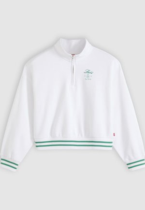 Bijela majica s dugim rukavima na četvrtasti patentni zatvarač, s prugastim zelenim manšetama i rubom te malim zelenim logotipom "Levi's" na lijevoj strani prsa.