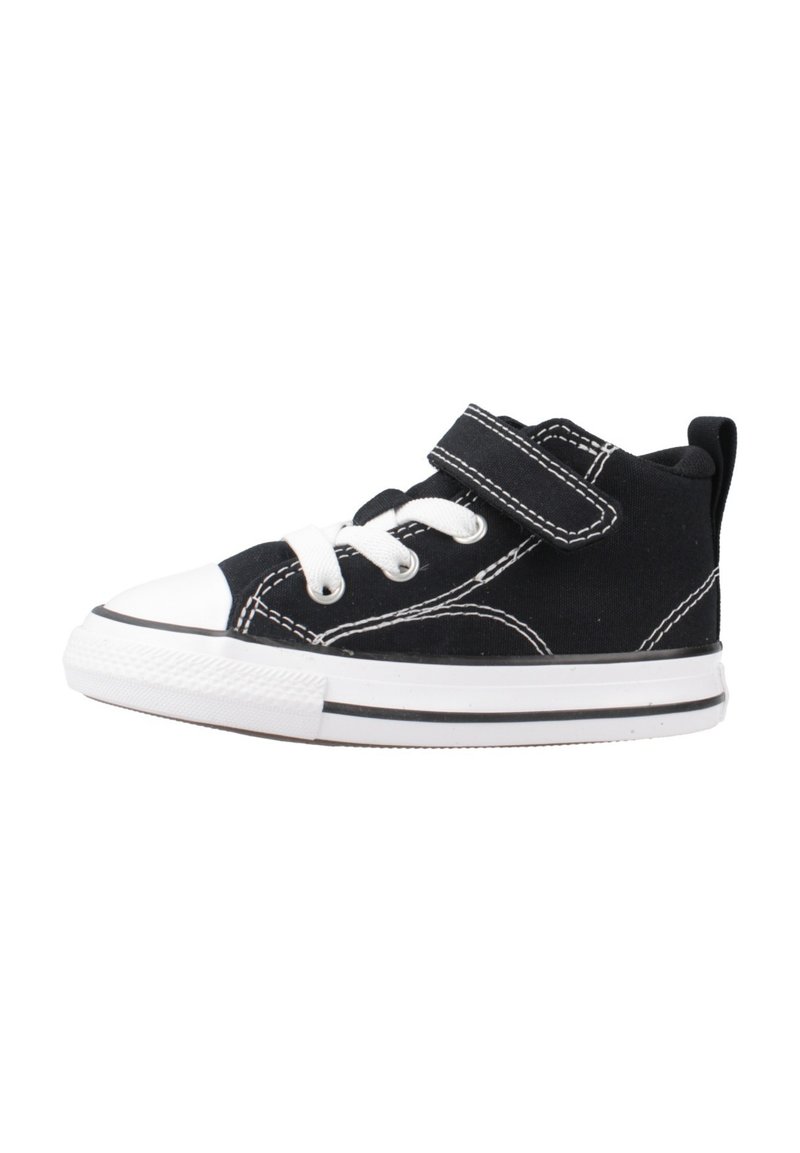 Sneaker nera in tela con punta in gomma bianca, lacci e cinturino in velcro. Presenta cuciture bianche e una striscia nera sulla suola.