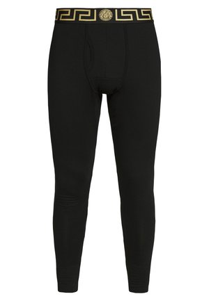Schwarze Stretchleggings mit einem goldenen Musterbund mit einem Medusa-Symbol und geometrischen Designs. Funktionales Frontöffnungsdetail.