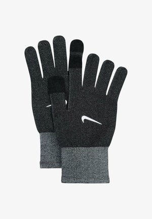 Guanti lavorati a maglia neri con finitura testurizzata, caratterizzati da un polsino grigio e dal logo Nike Swoosh bianco. Progettati per calore e destrezza.