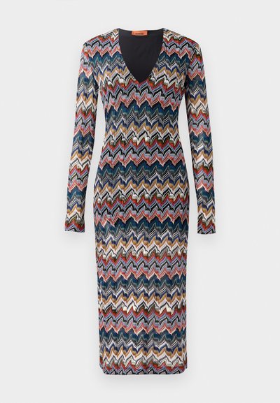Long-sleeve dress featuring a zigzag pattern in blue, red, cream, and gold hues. V-neck design; knit fabric with a fitted silhouette.